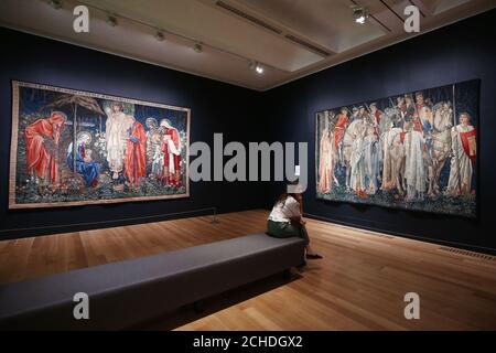 The Adoration of the Magi, 1894, (left) and The Holy Grail Tapestries: The Arming and Departure of the Knights of the Round Table on the Quest for the Holy Grail, 1890-4, by Edward Burne-Jones during a photo call for a major retrospective of the Pre-Raphaelite painter at Tate Britain in London. Stock Photo