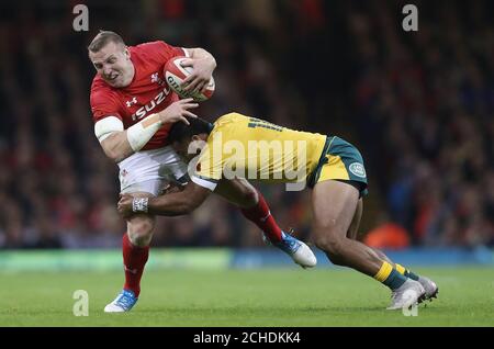 Wales Hadleigh Parkes is tackled by Australia's Sefa Naivalu during the Autumn International match at the Principality Stadium, Cardiff. Stock Photo