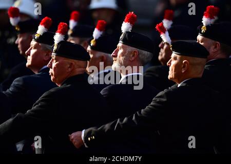 The veterans march past the Cenotaph during the remembrance service in Whitehall, central London, on the 100th anniversary of the signing of the Armistice which marked the end of the First World War. Stock Photo