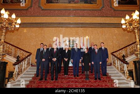 https://l450v.alamy.com/450v/2che135/prime-minister-theresa-may-centre-left-and-polands-prime-minister-mateusz-morawiecki-centre-right-pose-with-members-of-their-respective-cabinets-including-britains-business-secretary-greg-clark-left-defence-secretary-gavin-williamson-second-left-home-secretary-sajid-javid-third-left-chancellor-of-the-exchequer-philip-hammond-fourt-left-foreign-secretary-jeremy-hunt-fifth-left-and-from-poland-foreign-minister-jacek-czaputowicz-fifth-right-entrepreneurship-and-technology-minister-jadwiga-emilewicz-fourth-right-interior-and-administration-minister-joachim-brudzinski-2che135.jpg