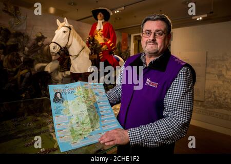 Dr Jonathan Mattison, curator of the Museum of Orange Heritage in Belfast with a copy of the Williamite Trail. Orangemen are hoping to revive interest in a forgotten battle of the 1690s with the help of an all-Ireland tourist trail. Stock Photo