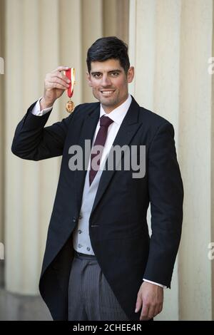 Sir Alastair Cook with his knighthood for services to cricket following an investiture ceremony at Buckingham Palace, London. Stock Photo
