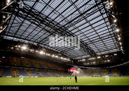 Firemen water the pitch ahead of the UEFA Euro 2020 Qualifying, Group I match at the Astana Arena. Stock Photo