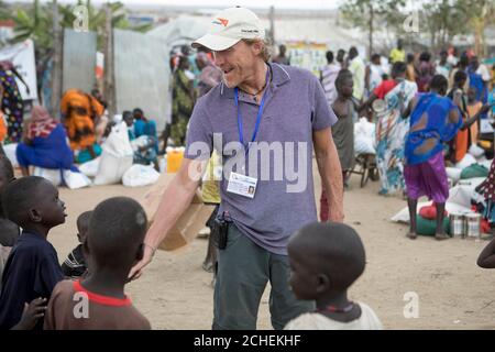 ONE USE ONLY NO ARCHIVE EDITORIAL USE ONLY Actor Jerome Flynn meets survivors of the conflict in South Sudan at a camp for internally displaced people, as part of an appeal from international children's charity World Vision. Stock Photo