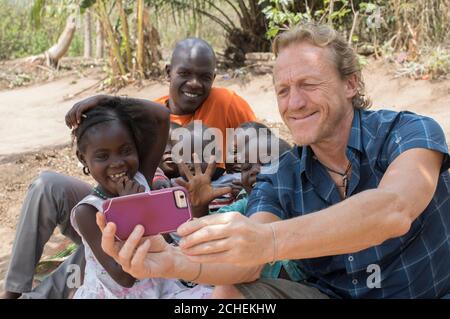 ONE USE ONLY NO ARCHIVE EDITORIAL USE ONLY Actor Jerome Flynn meet children affected by the conflict in South Sudan, as part of an appeal from international children's charity World Vision. Stock Photo