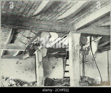 . Bulletin of the United States Geological Survey--The San Francisco Earthquake and Fire of April 18, 1906 and their effects on structures and structural materials . A. EARTHQUAKE CRACKS IN WALL OF VAULT, CALIFORNIA CASKET COMPANYS BUILDING, SAN FRANCISCO. Photograph by Richard L. Humphrey.. 11. COLLAPSE OF FLOOR PANEL, CAUSED BY LOAD FALLING FROM A FLOOR ABOVE, THIRDFLOOR OF /ETNA BUILDING, SAN FRANCISCO. The failure of the upper floor was due to the softening by heat of reenforcing steel bands. Photographsby Richard L. Humphrey. Stock Photo