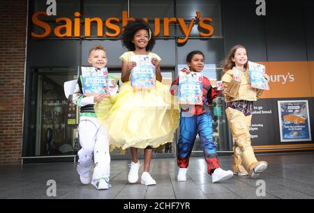 EDITORIAL USE ONLY Left to right Tayler Boileau dressed as Buzz Lightyear Amaura Crossley dressed as Belle Damani dressed as Spider Man and Evangelina Brannan dressed as C 3PO as Sainsbury s and Disne...