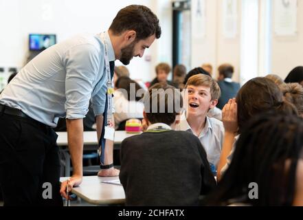 EDITORIAL USE ONLY Students and teachers from the Archer Academy in East Finchley participate in an educational session led by the National Citizen Service (NCS), which has been designed to encourage and support youth social activism outside the classroom, London. Stock Photo