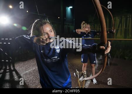 EDITORIAL USE ONLY Abi Cowie (right) and Olivia McLoughlin, both 15, from Birmingham City Regional Talent Club, which is an all female football team, participate in an archery/climbing/assault course challenge at The Bear Grylls Adventure to find 'Birmingham's Toughest Girl', and mark this Friday's International Day of the Girl. Stock Photo