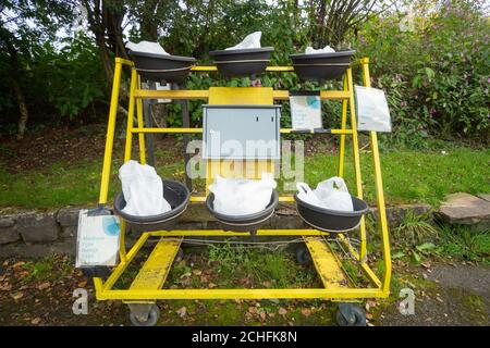 Free range hen and duck eggs for sale in a lane near a farm. An honesty box is provided for payment. Near Whitefield, Prestwich, England UK Stock Photo