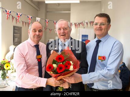 EDITORIAL USE ONLY Ray Herrington, aged 80, receives a commemorative bouquet from store manager Mark Fitzgerald and dedicated to him by his son Mark Herrington, to recognise his serving in the Queen's Flight, at a tea party hosted by Sainsbury's for the Armed Forces community in Preston, to raise funds for this year's Poppy Appeal. PA Photo. Picture date: Friday November 8, 2019. This year, Sainsbury's celebrates its 25th year of partnering with The Royal British Legion's Poppy Appeal. Photo credit should read: Dave Thompson/PA Wire Stock Photo