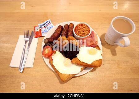 EDITORIAL USE ONLY Morrisons launches their 'Black Fry-Day' breakfast, available during the Black Friday sales, the 19-piece meal includes; three sausages, three rashers of bacon, three hash browns, baked beans, mushrooms, two halves of tomato, two fried eggs, two slices of black pudding and two half slices of fried bread for ??5. PA Photo. Issue date: Wednesday November 27, 2019. Other deals on offer at Morrisons include a third off on all champagnes and magnums of Prosecco Doc Spumante by Palazzo Nobile for ??10, available from 27th November. Photo credit should read: Nigel Roddis/PA Wire  Stock Photo
