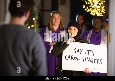 Martine McCutcheon joins Christmas carollers to launch a sweet treat giveaway by online food delivery service Uber Eats in partnership with Tinseltown. PA Photo: Issue date: Tuesday December 3, 2019. Lucky customers will receive from the Tinseltown restaurant a Banoffee pie or chocolate biscuits via the online food delivery service in London on December 6th and Birmingham on December 9th. Photo credit should read: David Parry/PA Wire Stock Photo