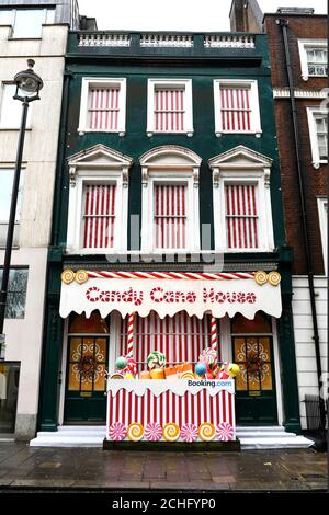 EDITORIAL USE ONLY A Candy Cane House is unveiled in Soho by Booking.com, just in time for the festive period. Stock Photo