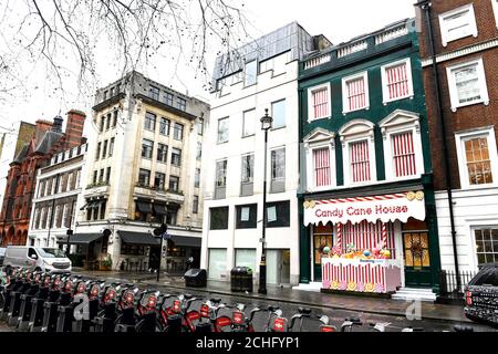 EDITORIAL USE ONLY A Candy Cane House is unveiled in Soho by Booking.com, just in time for the festive period. Stock Photo