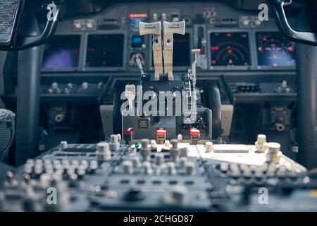Thrust levers in cockpit or pilot cabin of airplane Stock Photo