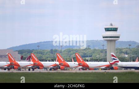 EasyJet planes grounded due to the coronavirus outbreak are parked at Gatwick Airport in Sussex. Stock Photo