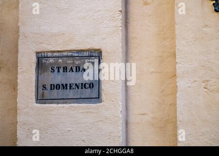 BARI, ITALY - SEPTEMBER 1, 2020: sunlight is enlightening signboard of Saint Domenico Stock Photo