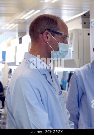 The Duke of Cambridge wears a mask during a visit to the manufacturing laboratory where a vaccine against COVID-19 has been produced at the Oxford Vaccine Group's facility at the Churchill Hospital in Oxford. Stock Photo