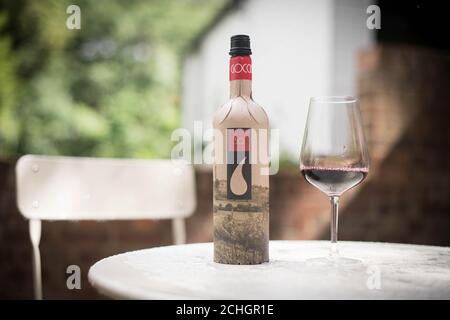 Frugal wine bottle, from British packaging company Frugalpac, which has a lower carbon and water footprint than glass or plastic alternatives. The bottle is made from recycled paperboard with a recycled plastic food-grade liner to hold the wine or spirit. Stock Photo