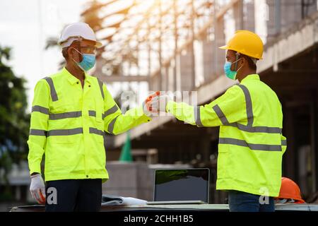 Greetings of engineers and construction site workers. Stock Photo
