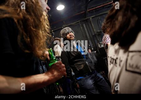 Owner Li Chi chats with his staff and remaining visitors at Mao Live House after its last public concert night in central Beijing, China April 24, 2016. Mao Live House, a prominent live rock music venue in Beijing, shut its doors on the weekend, the latest closure to hit China's rock music scene. Owner Li Chi said the club, popular among fans of punk, metal and alternative rock since it opened nine years ago, was forced to close due to tighter rules on live performances. REUTERS/Damir Sagolj      SEARCH 'MAO LIVE' FOR THIS STORY. SEARCH 'THE WIDER IMAGE' FOR ALL STORIES