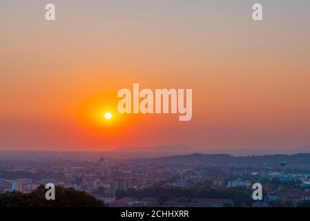 Time lapse of a sunset one hour in seven seconds. Red sunset over an urban city. Stock Photo