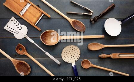 Cooking concept. Vintage kitchen utensils, empty culinary equipment flat lay on blue wooden table background, top view Stock Photo