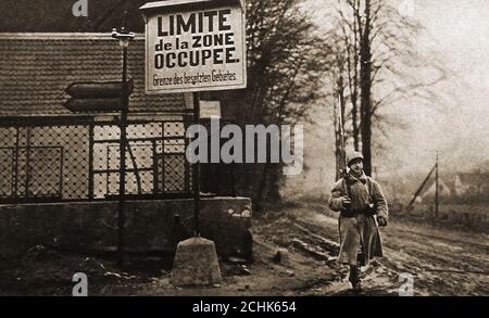 An old (1923)  photograph showing   an armed  French soldier at the limit of the French Zone of occupation in Ruhr, Germany. The Occupation of the Ruhr or Ruhrbesetzung,was a period of military occupation of that region of Germany by France and Belgium between 11 January 1923 and 25 August 1925. Occupation of the Ruhr impacted on  the economic crisis in Germany causng German civilians to  engage in acts of passive resistance and civil disobedience, during which 130 were killed. Consequently the French troops withdrew from the Ruhr  region in 1925. Stock Photo