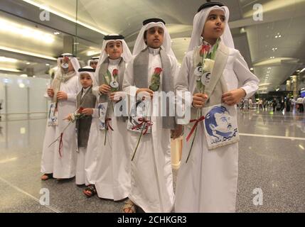 Flowers and pictures of Qatar Emir Sheikh Tamim Bin Hamad Al-Thani are  pictured during the arrival of Kuwaiti and Omani citizen at Hamad  international airport in Doha, Qatar June 22, 2017. REUTERS/Naseem