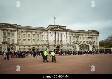 Buckingham Palace the official residence of Queen Elizabeth II and one of the major tourist destinations U.K. Entrance and main gate with lanterns. LO Stock Photo