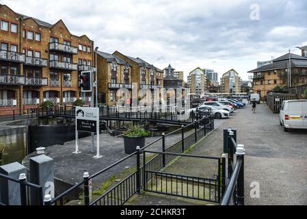 Entrance lock gates into canal leading to Limehouse Basin Marina in Docklands, London, England. LONDON, UK - April 5, 2017 Stock Photo