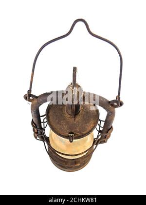 Old rusty kerosene lamp on a white background. Stock Photo