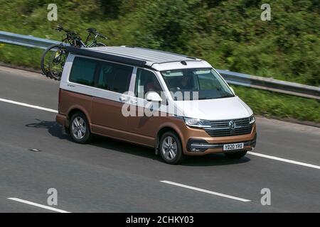 2020 white Volkswagen VW California Ocean Tdi camper Bronze Large MPV window van driving on the M6 motorway near Preston in Lancashire, UK. Stock Photo