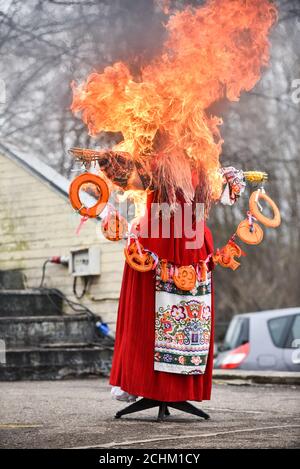 Slavic holiday end of winter. The big Shrovetide doll burns as a symbol of the approach of spring. Black smoke and bright flames Stock Photo