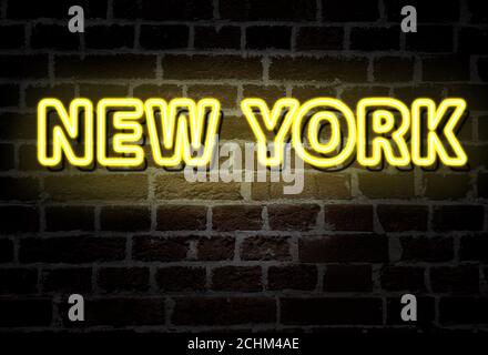 New York City - yellow neon sign on brick wall Stock Photo