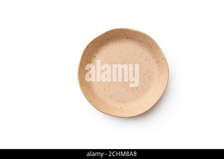 Flat lay yellow designed empty plate isolated on white background top view with copy space Stock Photo