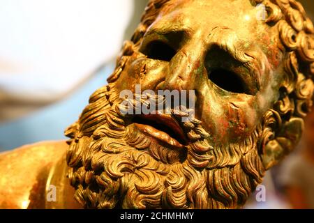 Boxer at rest statue. Close up view of boxer at rest statue in National Roman Museum, Italy. Stock Photo
