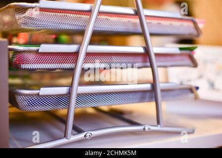 Silver metallic multi level office document tray closeup Stock Photo