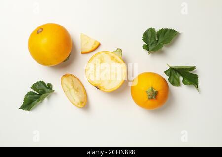 Round zucchini and leaves on white background Stock Photo