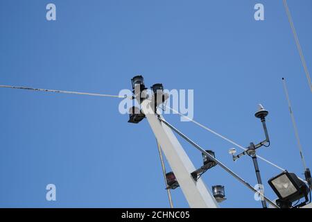 Low angle shot of position lights on the mast of a ship Stock Photo