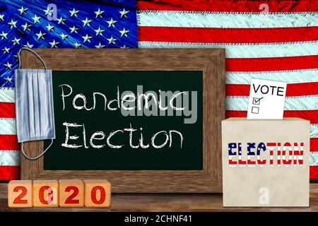 US pandemic elections concept with American flag hung behind wooden frame chalkboard for copy space, and ballot box with voter slip. Concept of voter Stock Photo