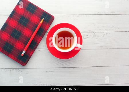 top view of green tea and notepad on wooden table  Stock Photo