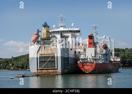 Berthed shipping on the River Fal in Cornwall 2011, A resting place for cargo ships and tankers. Falmouth has the deepest natural harbour in Europe. Stock Photo