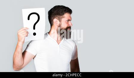 Man screaming, emotion. Man question. Male with question marks. Getting answers. Question mark, symbol. Concept - challenging issue, looking for the Stock Photo