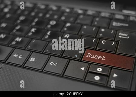 Reset concept. Reset key embedded in a computer keyboard Stock Photo