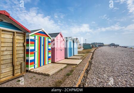 Typical seafront beach huts on the promenade at Budleigh Salterton, a small south coast town with a stony beach in East Devon, southwest England