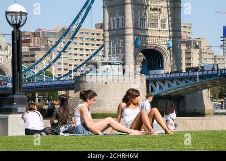 London, UK 14 Sept 2020 - Fewer people enjoy the warm and sunny weather in Potters Field Park during lunchtime as the mini heatwave continues in the capital. Field Park and nearby More London would normally be very busy with tourists and office workers during sunny weather. The government has announced that gatherings of more than six people are banned from today as the numbers of COVID19 cases have started to increase. Credit Dinendra Haria /Alamy Live News Stock Photo