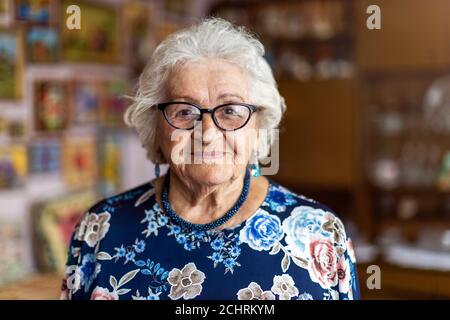 Portrait of an elderly woman at her home Stock Photo