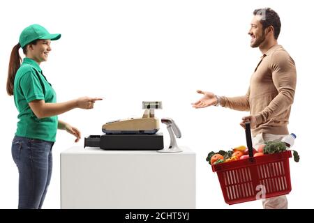 Man paying at a cash register with a shopping basket isolated on white background Stock Photo